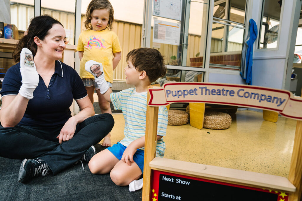 Educator interacting with children at Alfred Childcare in Melbourne