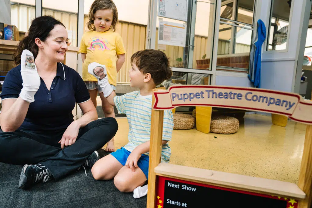 Educator interacting with children at Alfred Childcare in Melbourne