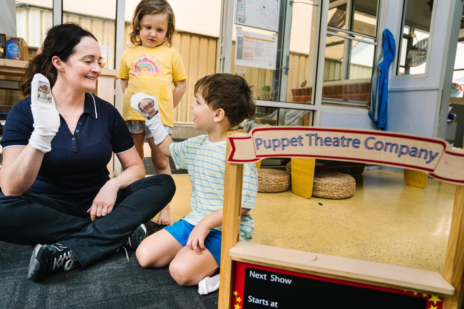 Educator interacting with children at Alfred Childcare in Melbourne