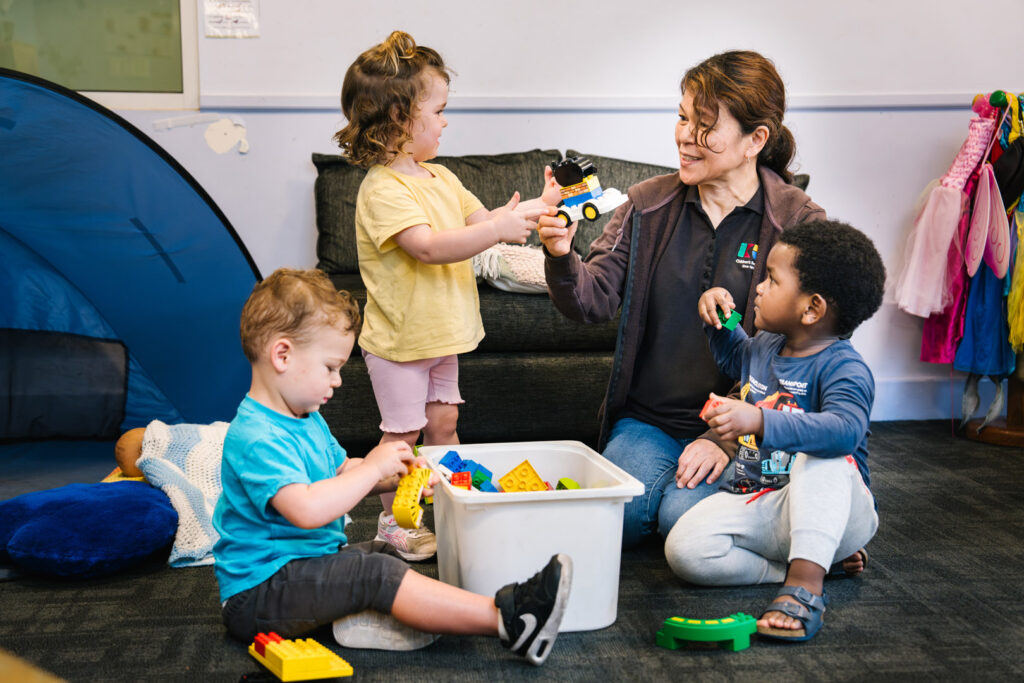 Educator interacting with children at Alfred Childcare in Melbourne