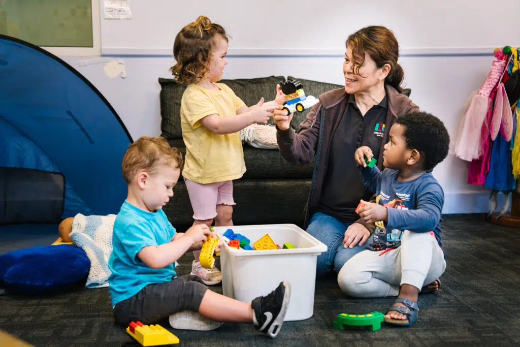Educator interacting with children at Alfred Childcare in Melbourne