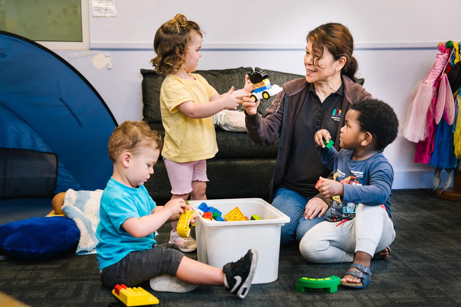 Educator interacting with children at Alfred Childcare in Melbourne