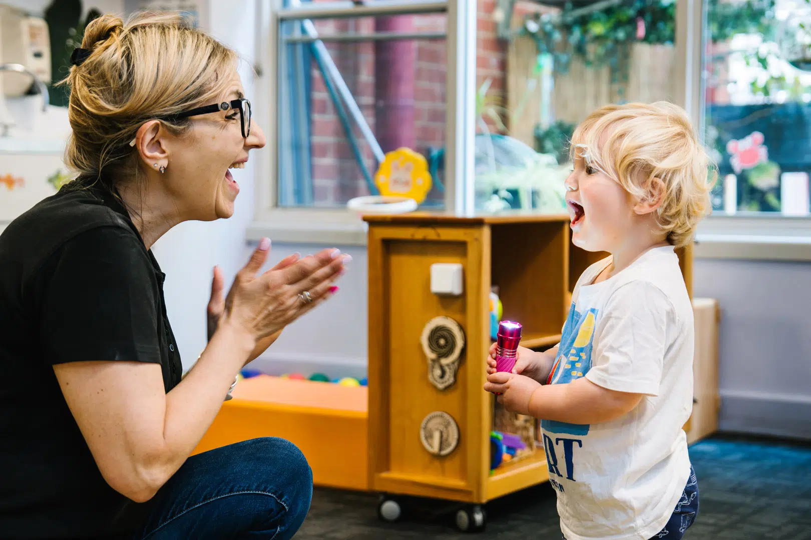 Educator interacting with child at Alfred Childcare in Melbourne