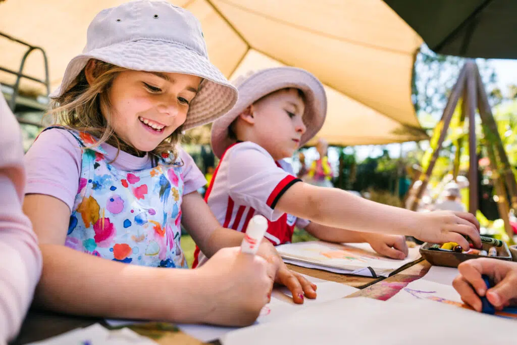 Children drawing pictures at KU Bel Air childcare