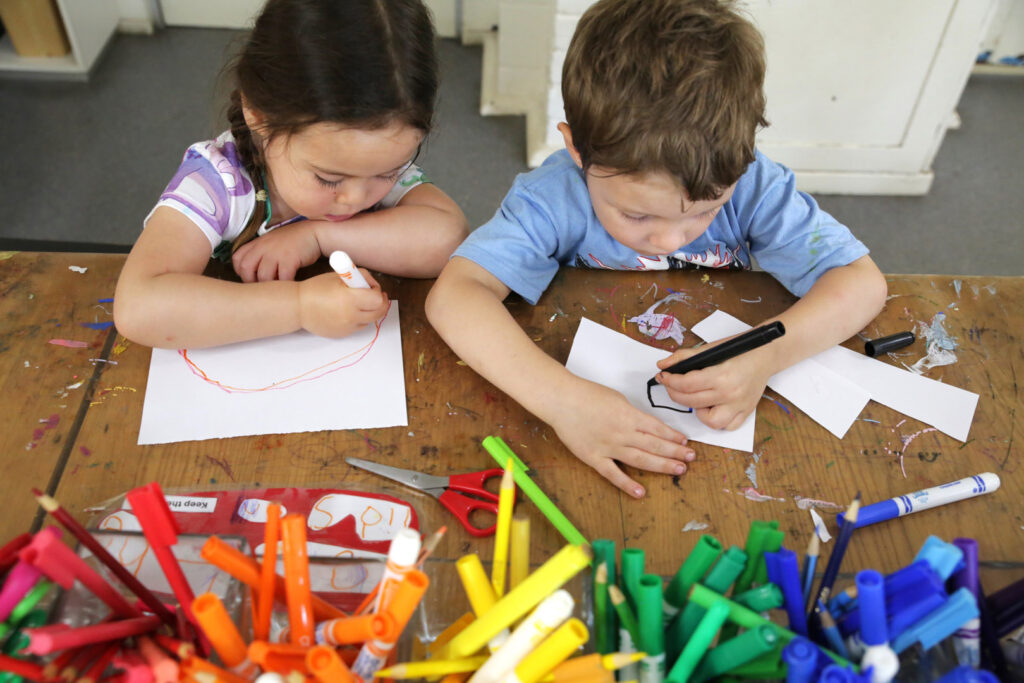 Children drawing at KU Sunbeam childcare in Alexandria