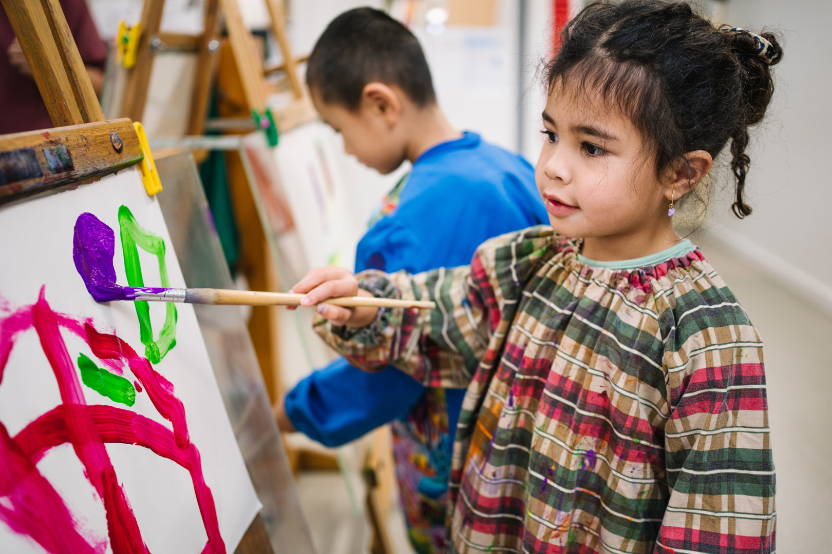 Children painting at childcare in Armstrong Creek