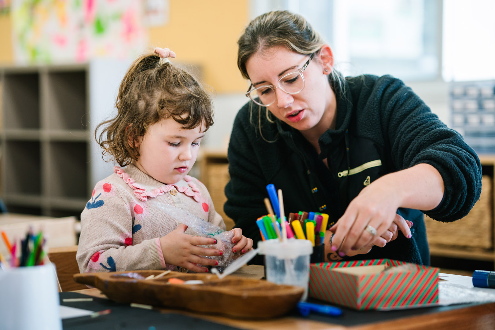 Educator and child engaged in play at Armstrong Kinder