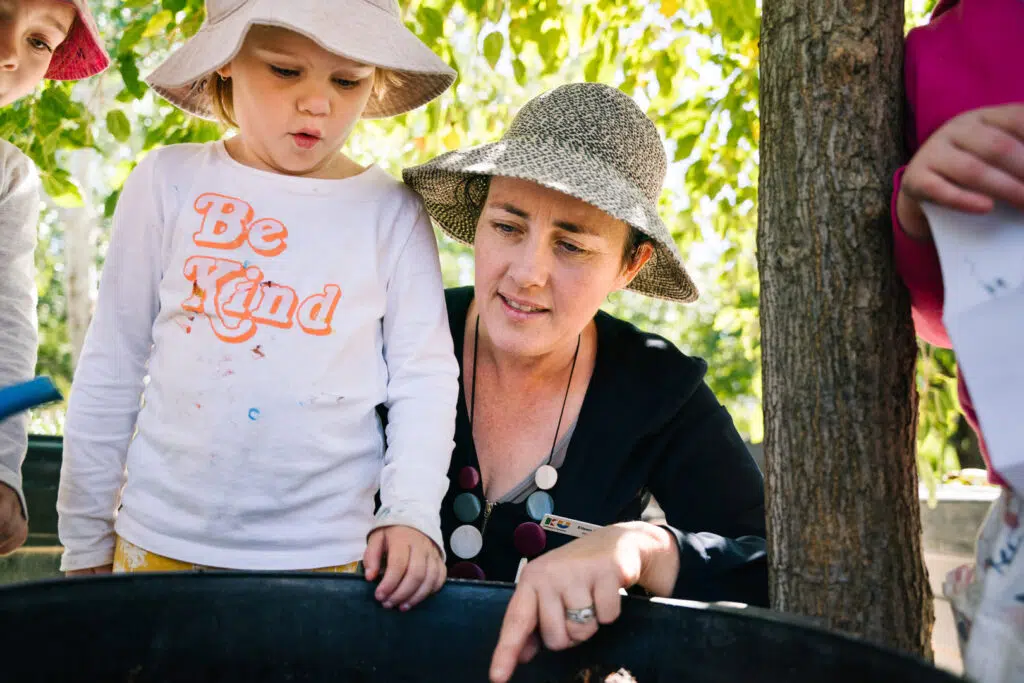 KU Ashmont educator interacting with a child