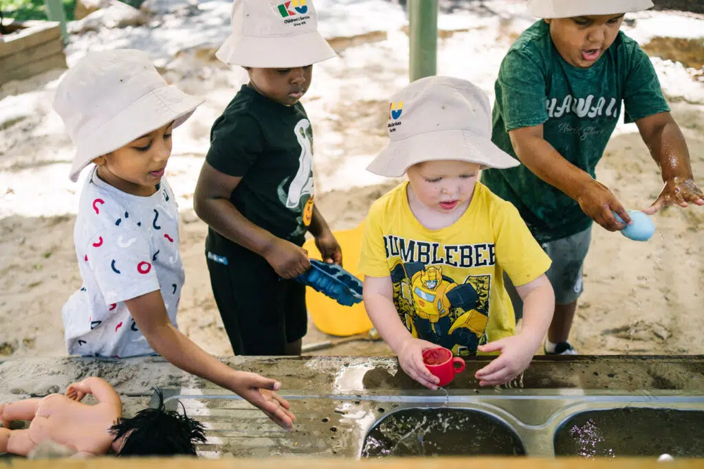 Children playing outdoors at KU Ashmont childcare