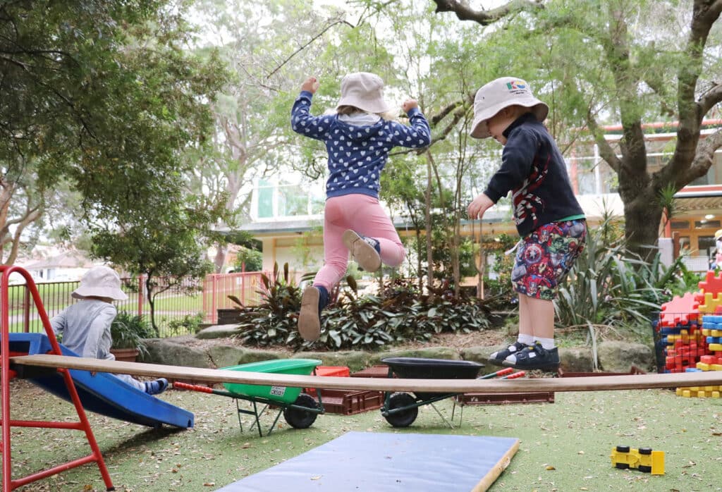 Children playing on equipment at KU Cammeray childcare