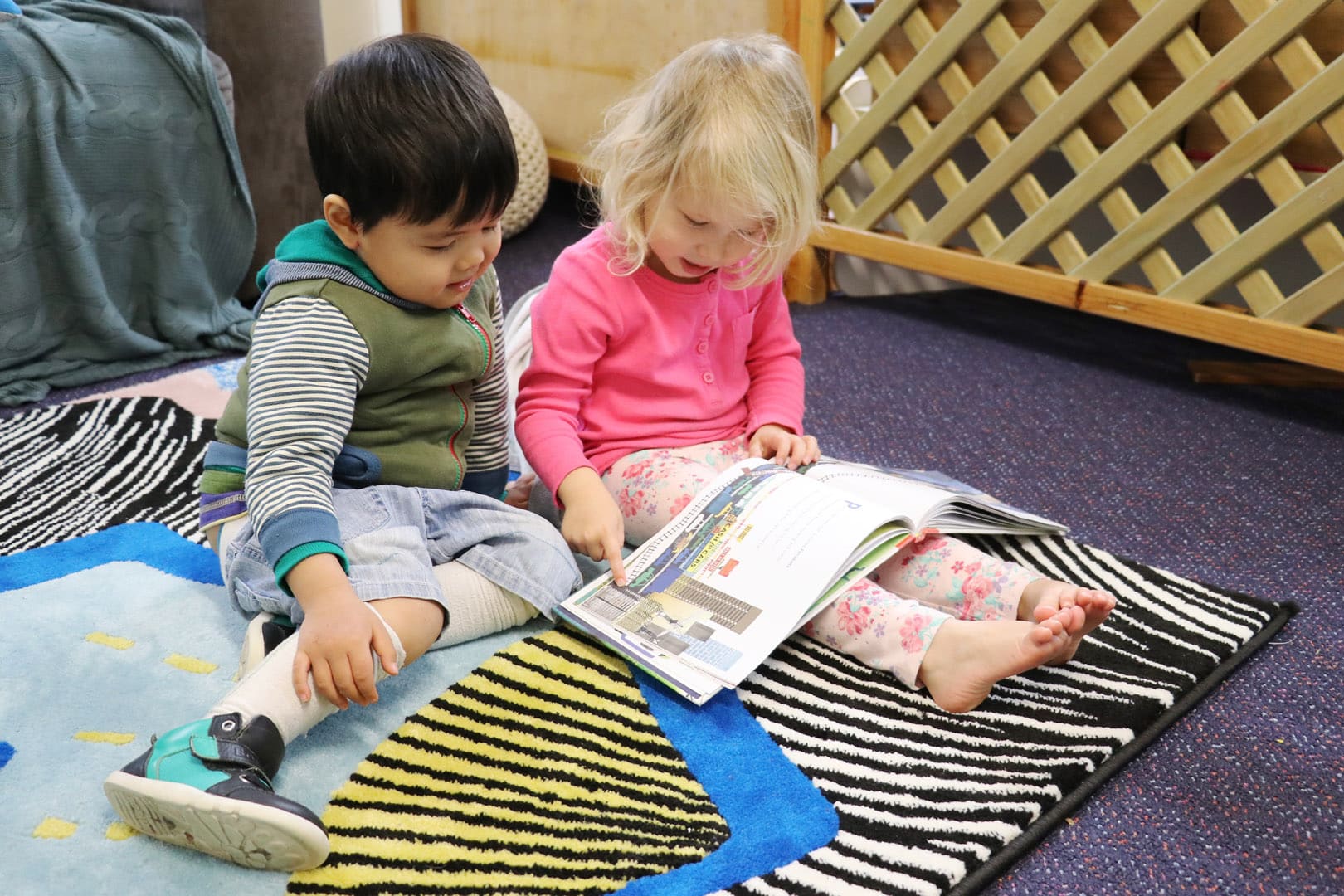 Children reading a story at KU Cammeray childcare
