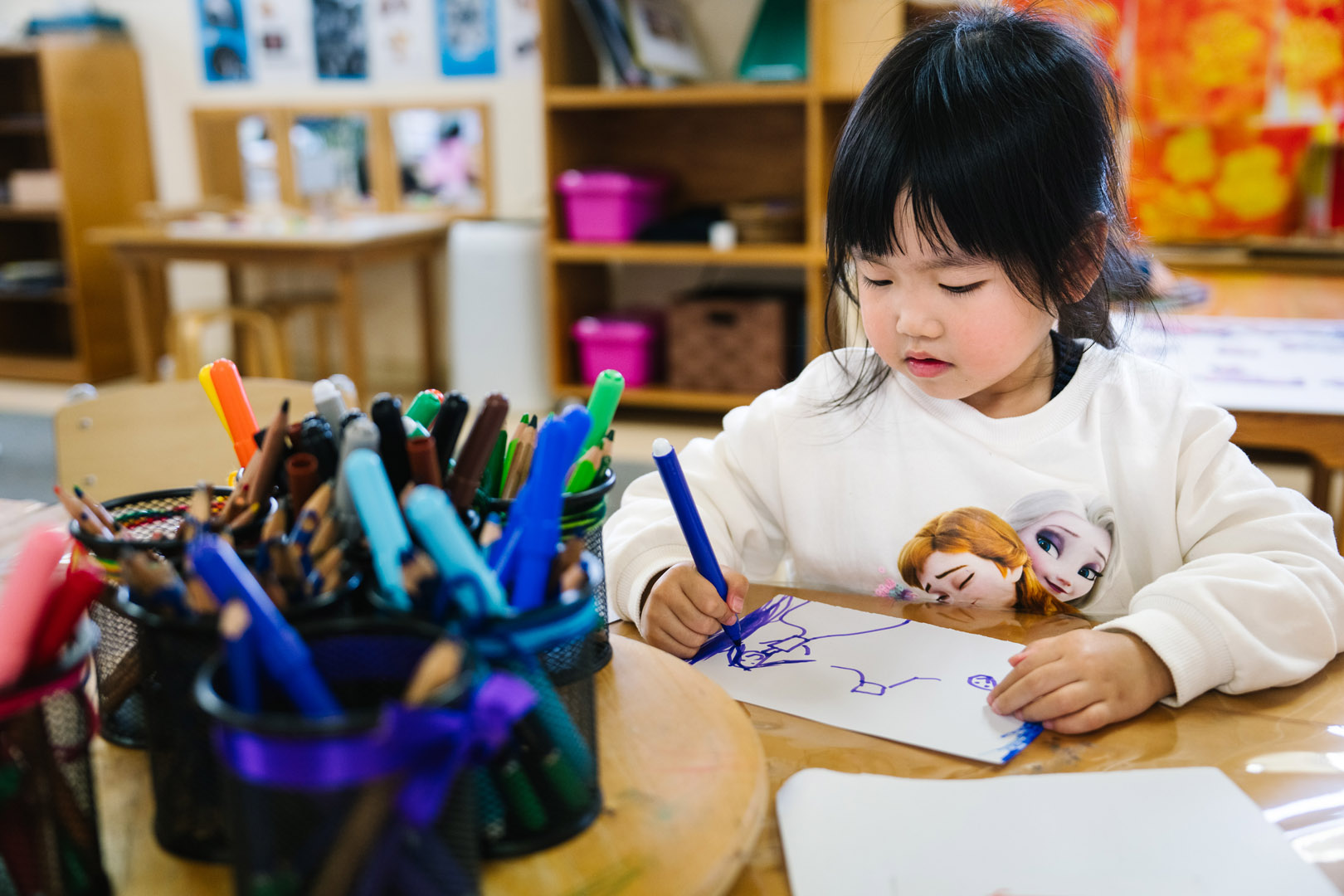 Child drawing at Castlecrag childcare