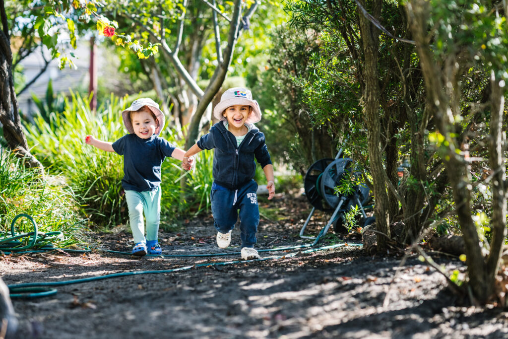 Children running in garden at KU Craigieburn Childcare