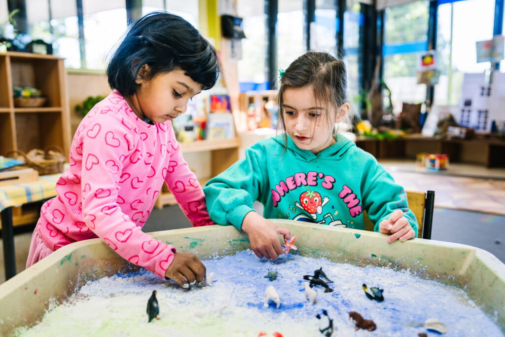 Children engaged at sensory table at KU Craigieburn Childcare