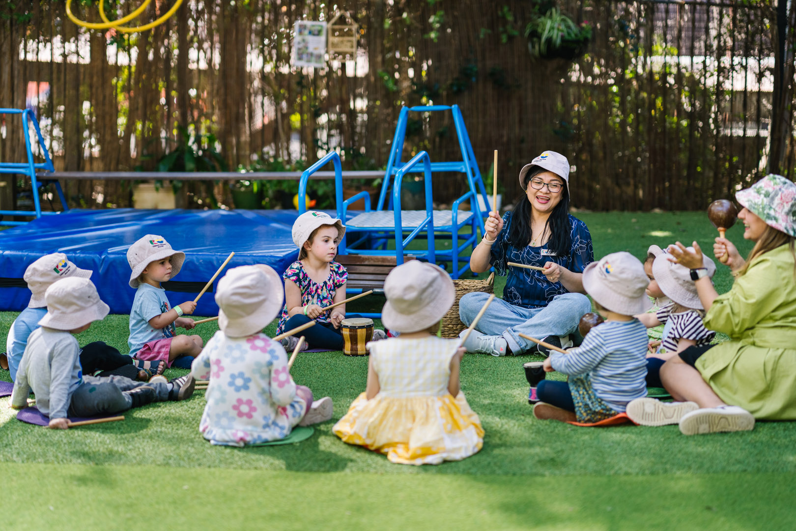 Educators and children playing music at Darlington childcare