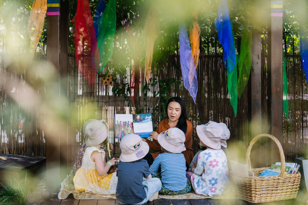 Educator reading to children at Darlington childcare