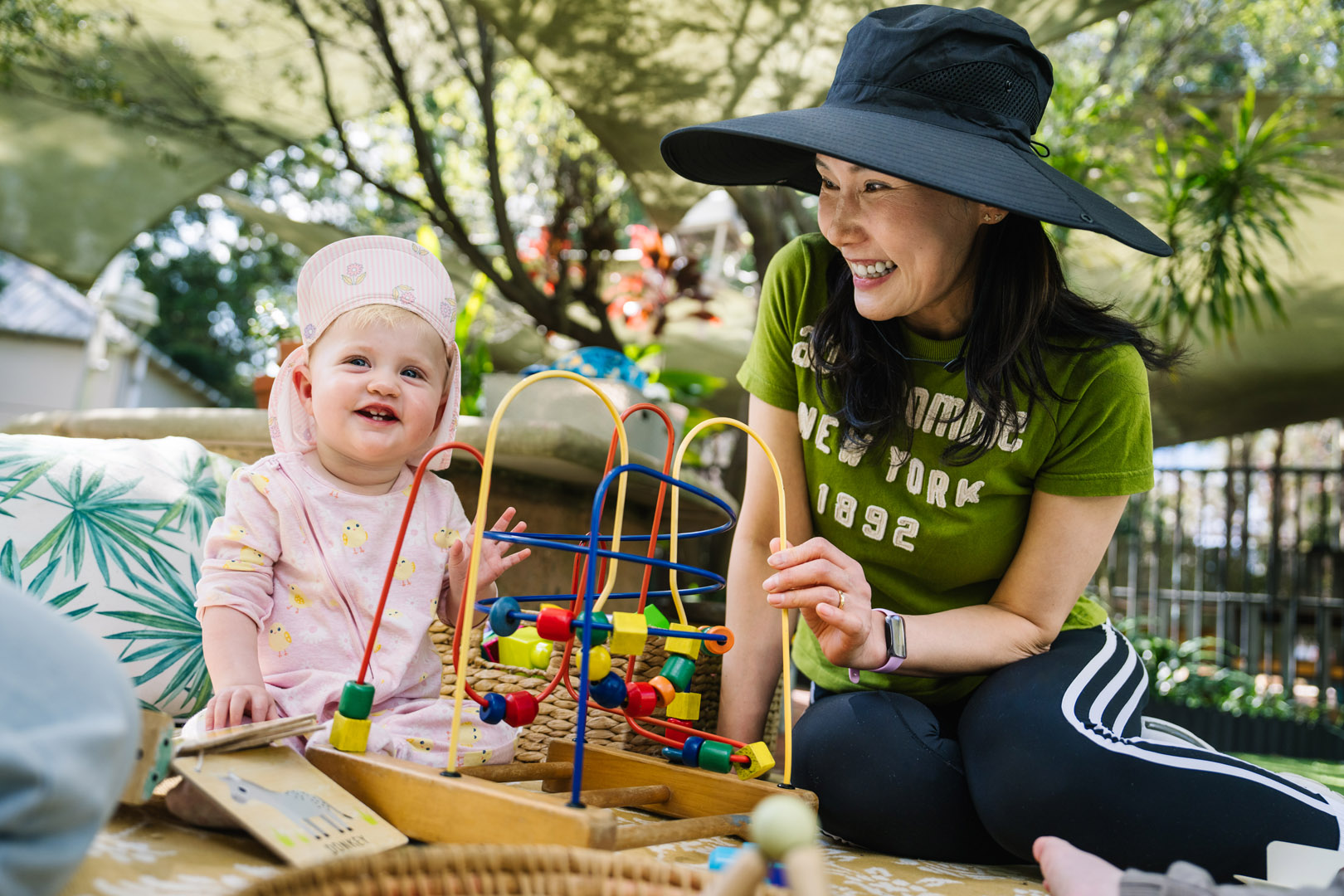 Baby and educator engaged in play at Darlington childcare