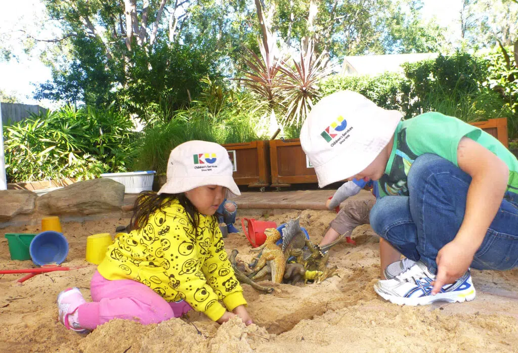 Children playing in the sand at KU Isobel Plus Memorial childcare