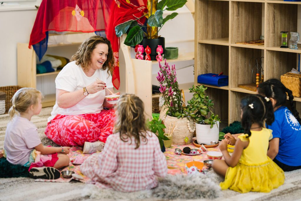 Educator engaging with children at Alexander Magit Kindergarten in Ferntree Gully