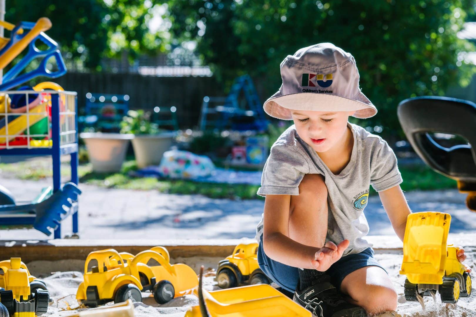 Child playing outdoors at Alexander Magit Kindergarten in Ferntree Gully