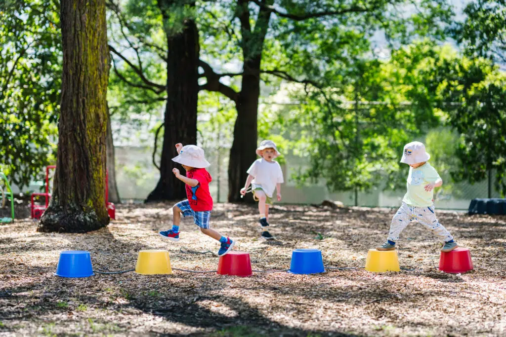 Children playing outdoors at FW Kerr Kindergarten in Ferntree Gully