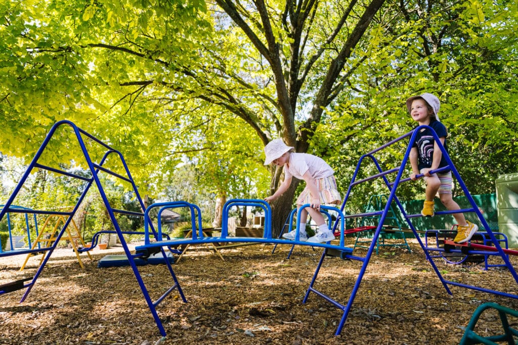 Children playing outdoors at FW Kerr Kindergarten in Ferntree Gully