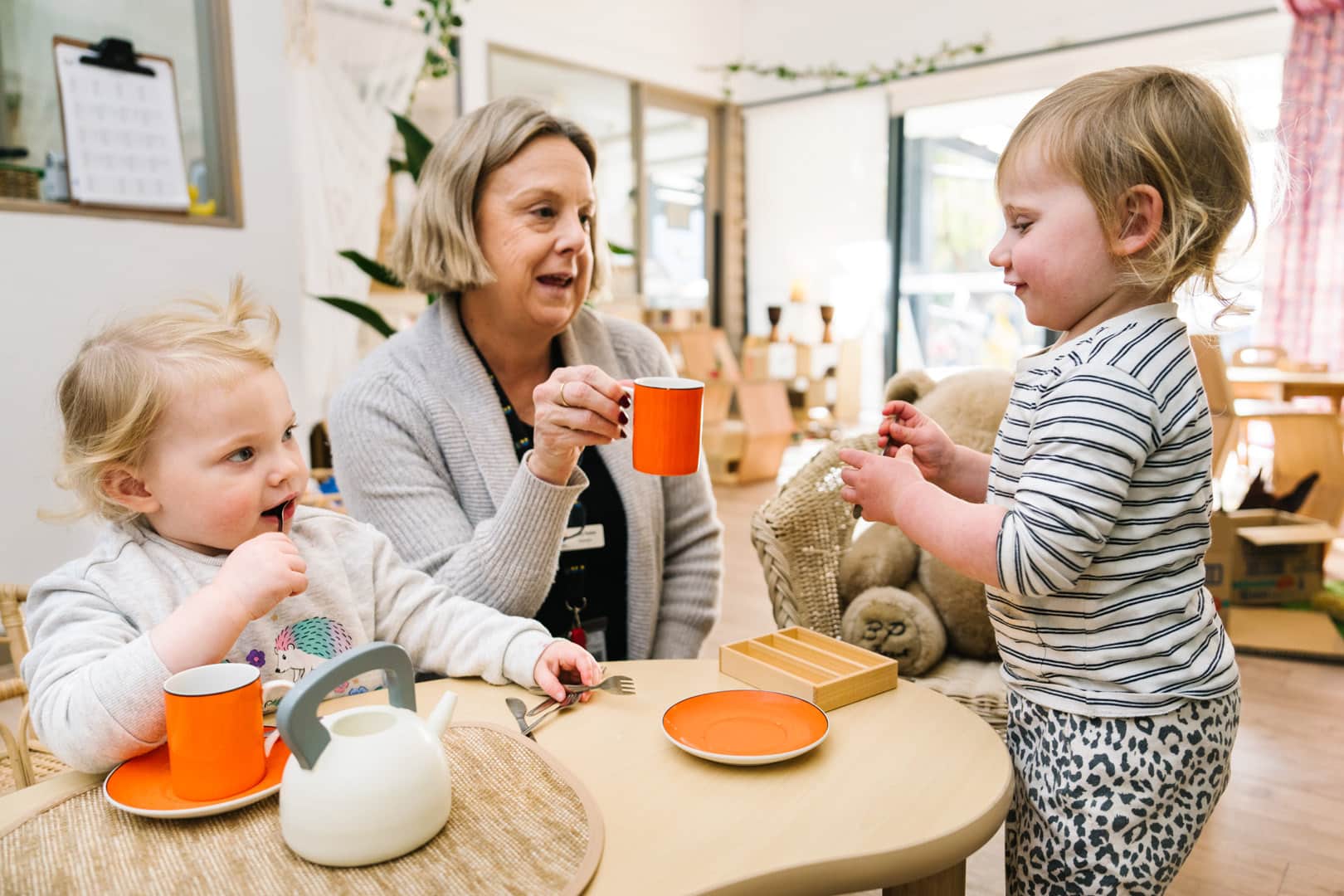 KU Monash childcare educator having a tea party with children