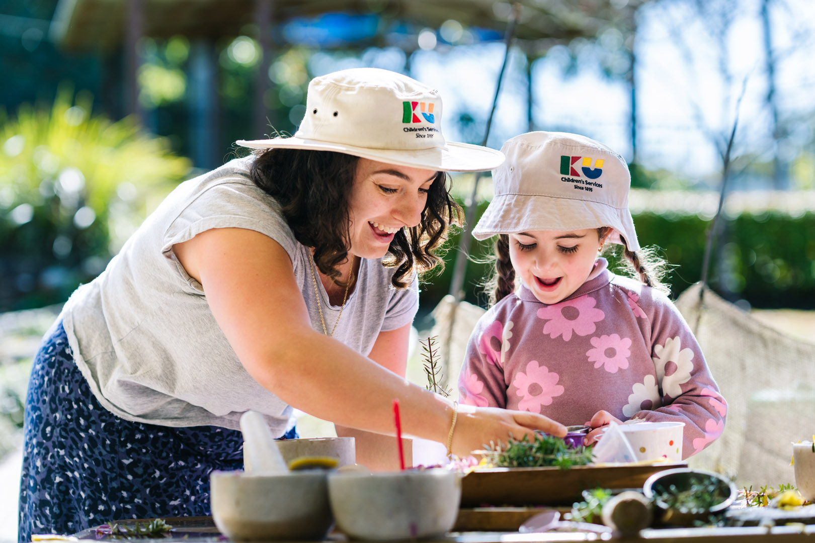 Child and educator playing at KU Galston childcare