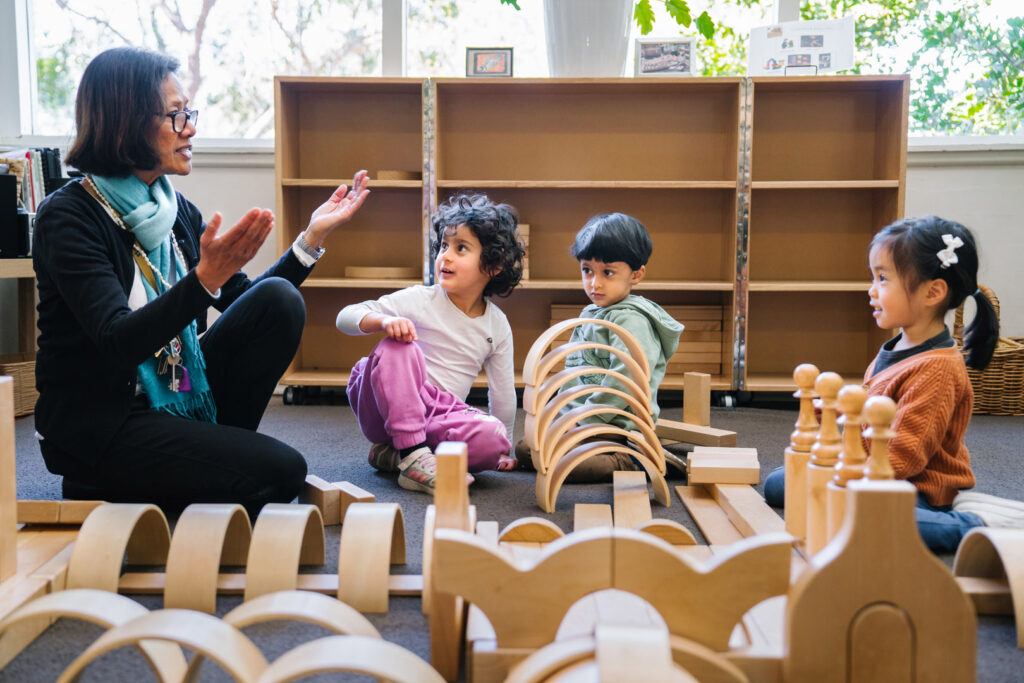 KU Greenwich childcare educator interacting with children