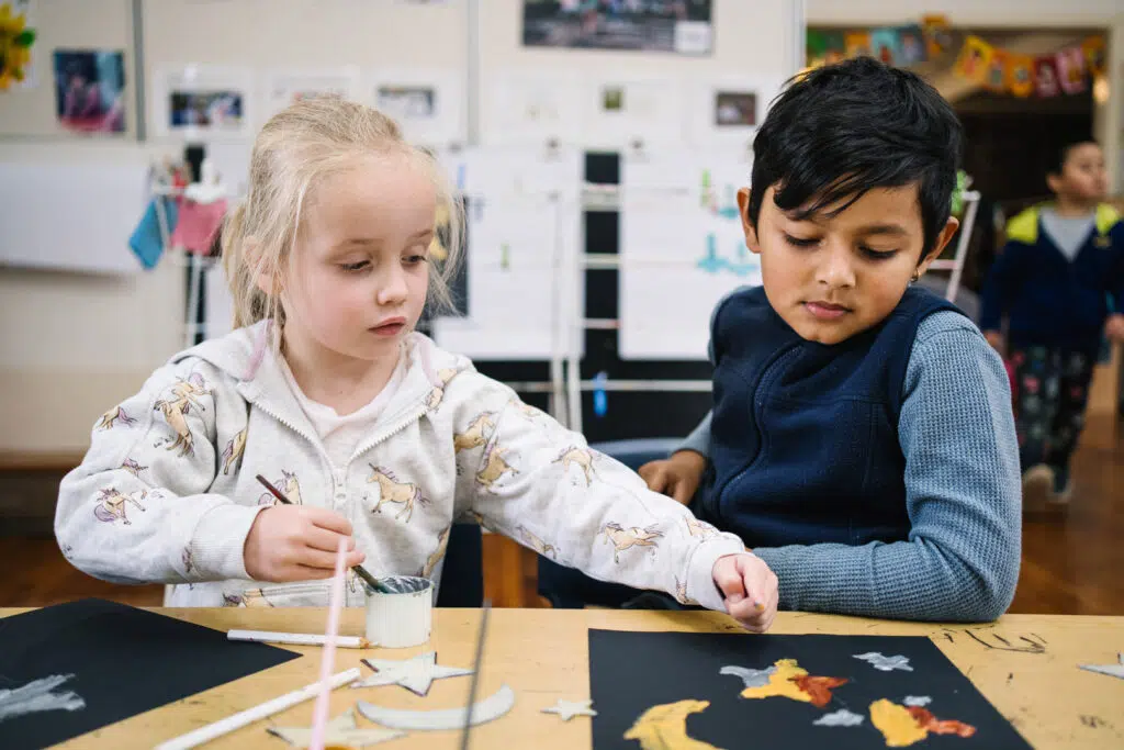 Children doing a painting at Gwynneville childcare
