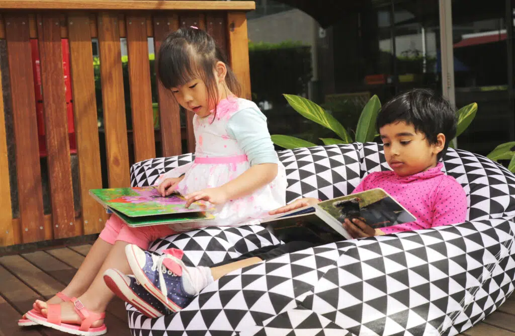 Children reading at KU Kogarah childcare