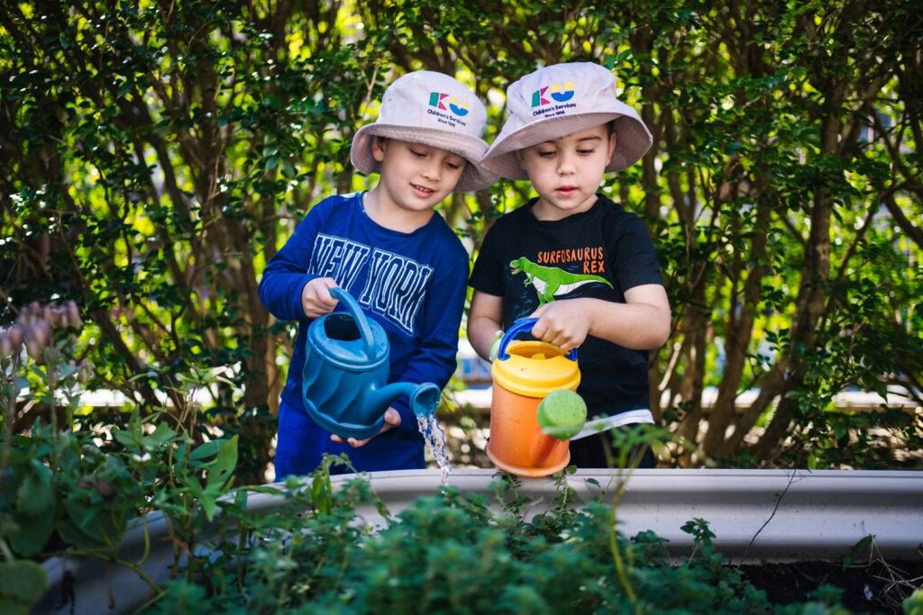 children watering garden at Kogarah childcare