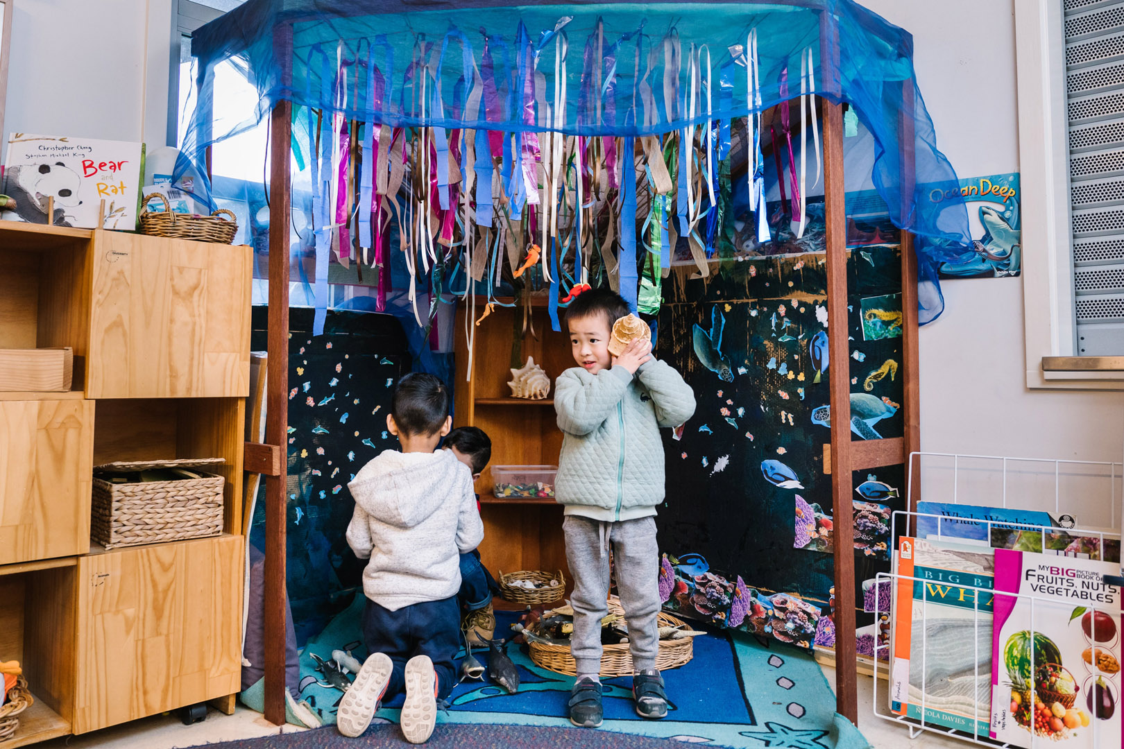 Children playing indoors at KU Liverpool childcare
