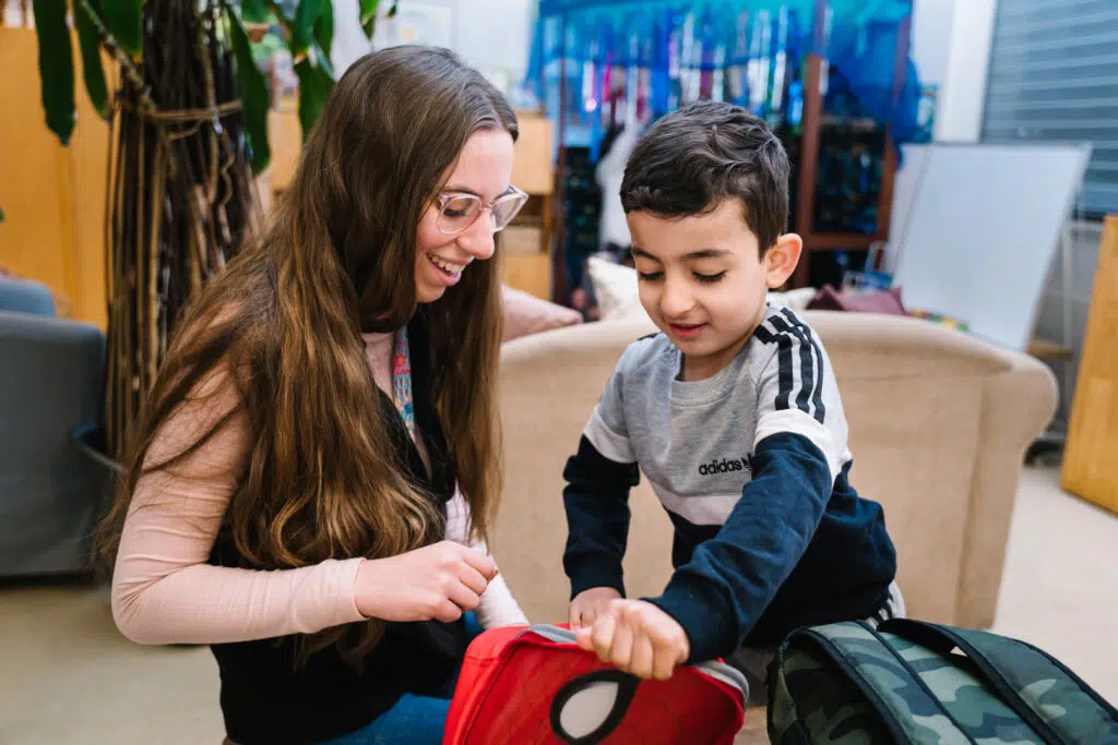 KU Liverpool childcare educator interacting with a child