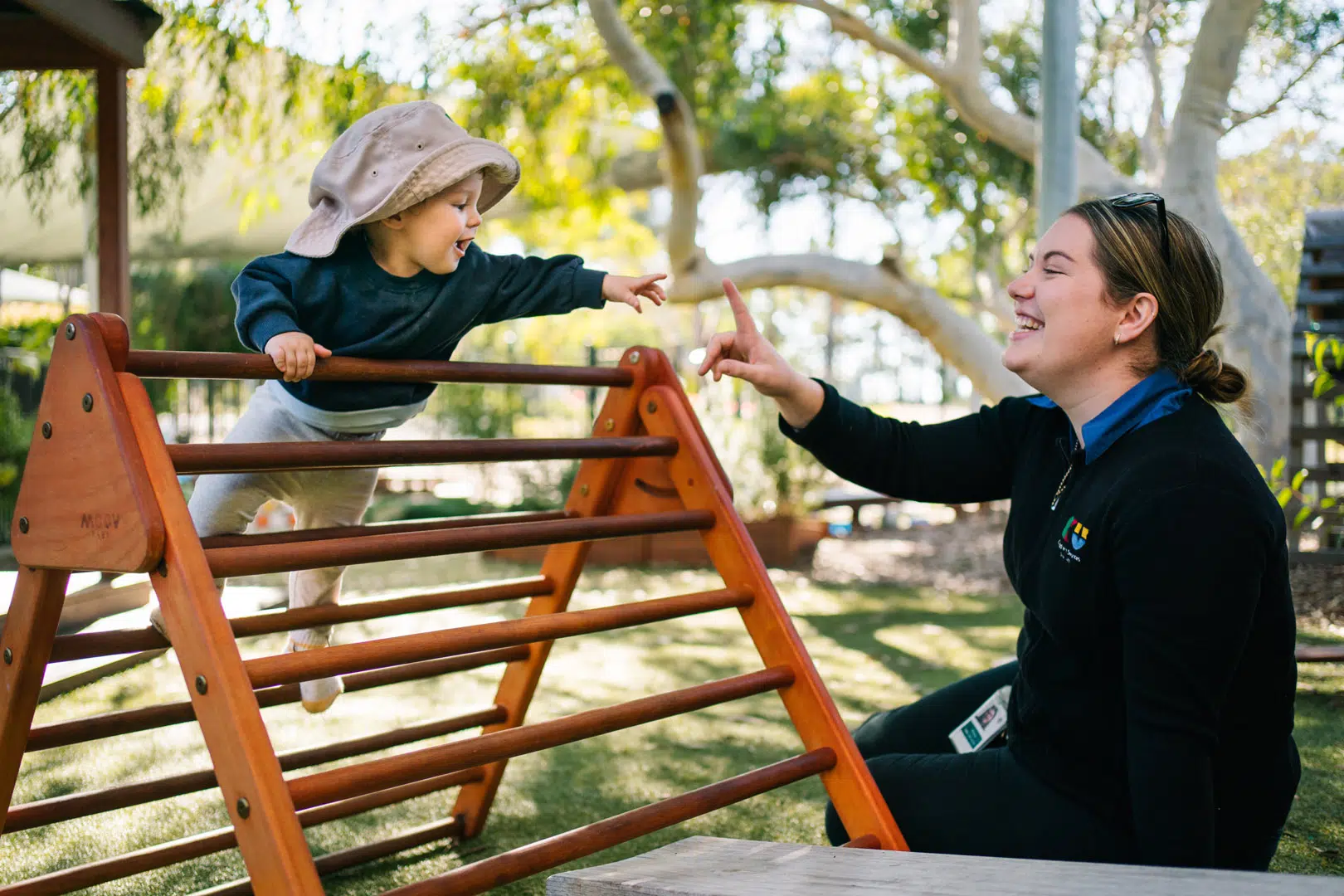 KU ANSTO childcare educator interacting with a child
