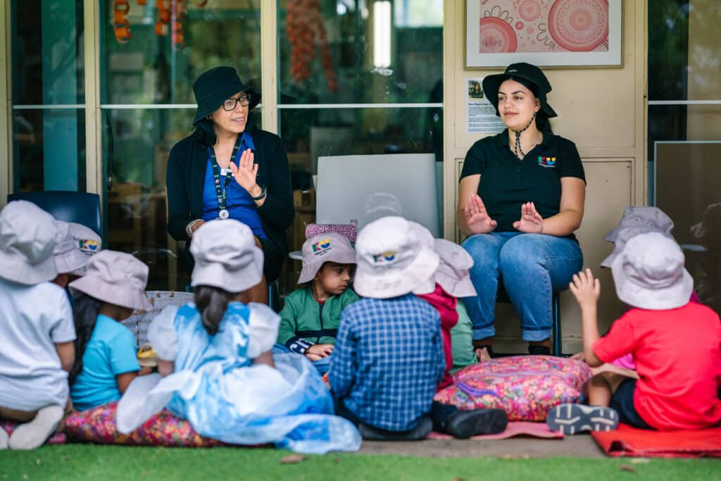 KU Macquarie Fields childcare educators singing a song with children