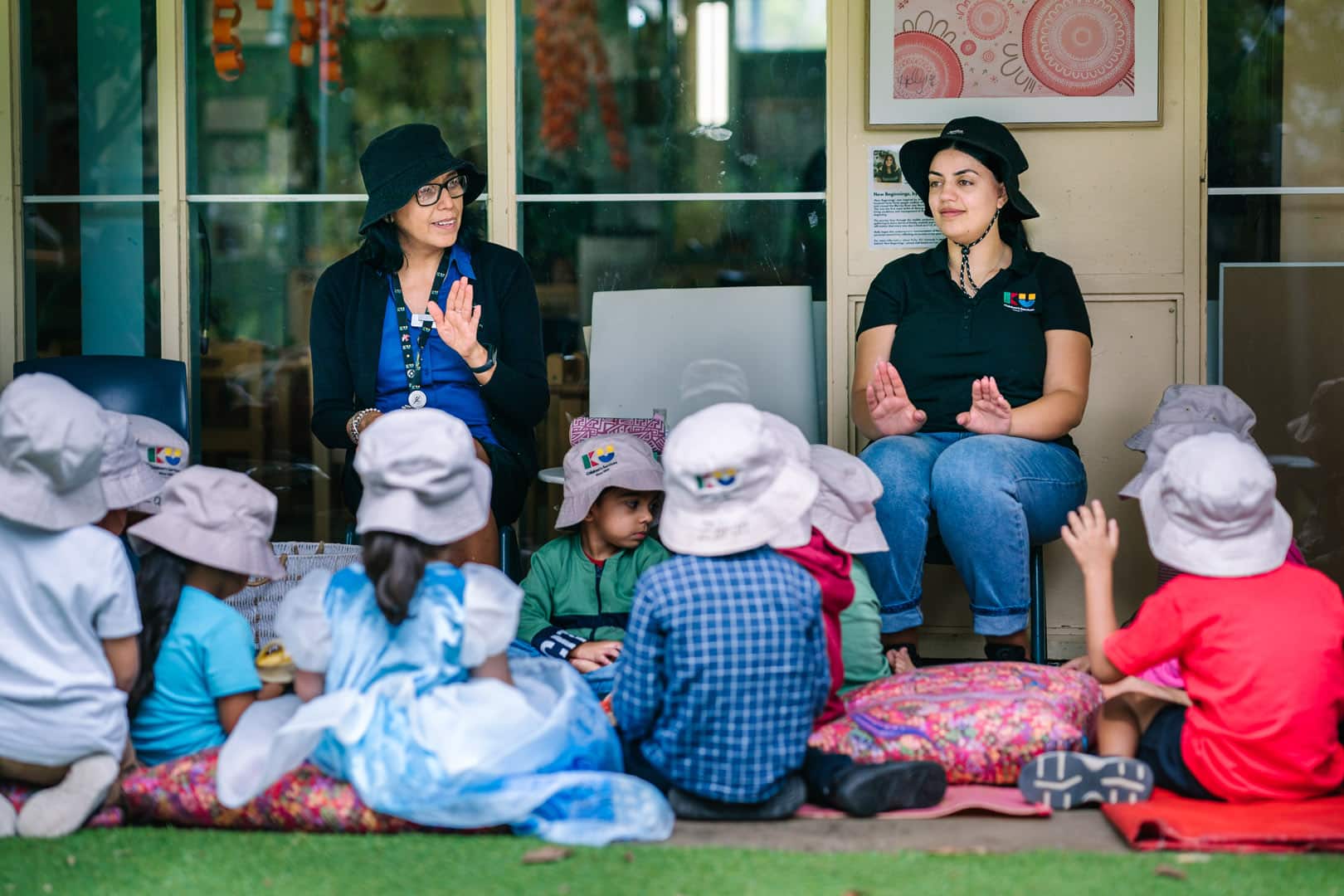 KU Macquarie Fields childcare educators singing a song with children