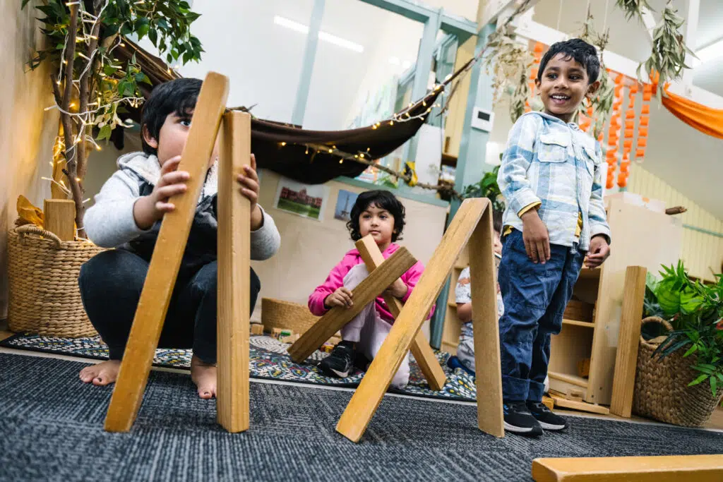 Children playing with wooden blocks at KU Macquarie Fields childcare