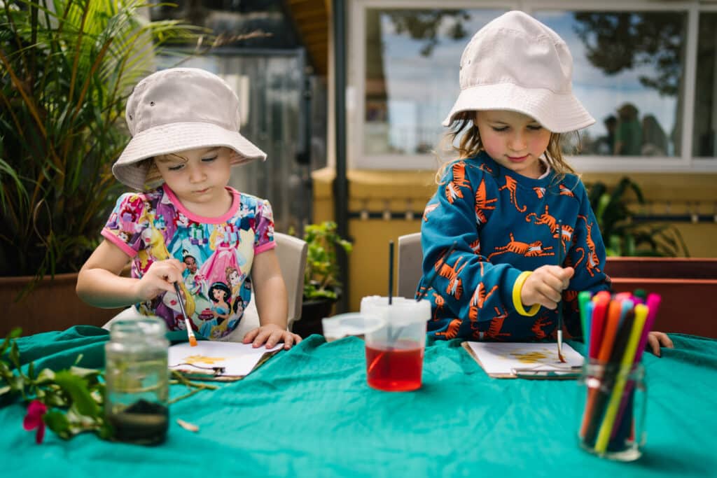 Children painting at KU Lance childcare