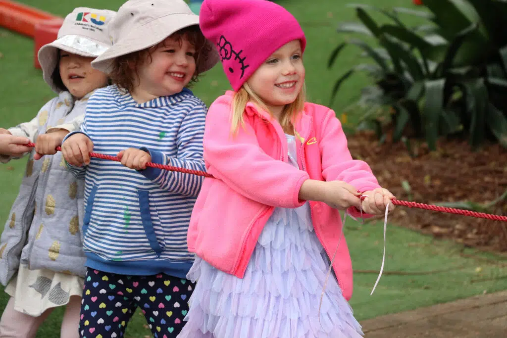 Children playing tug of war at KU Mosman childcare