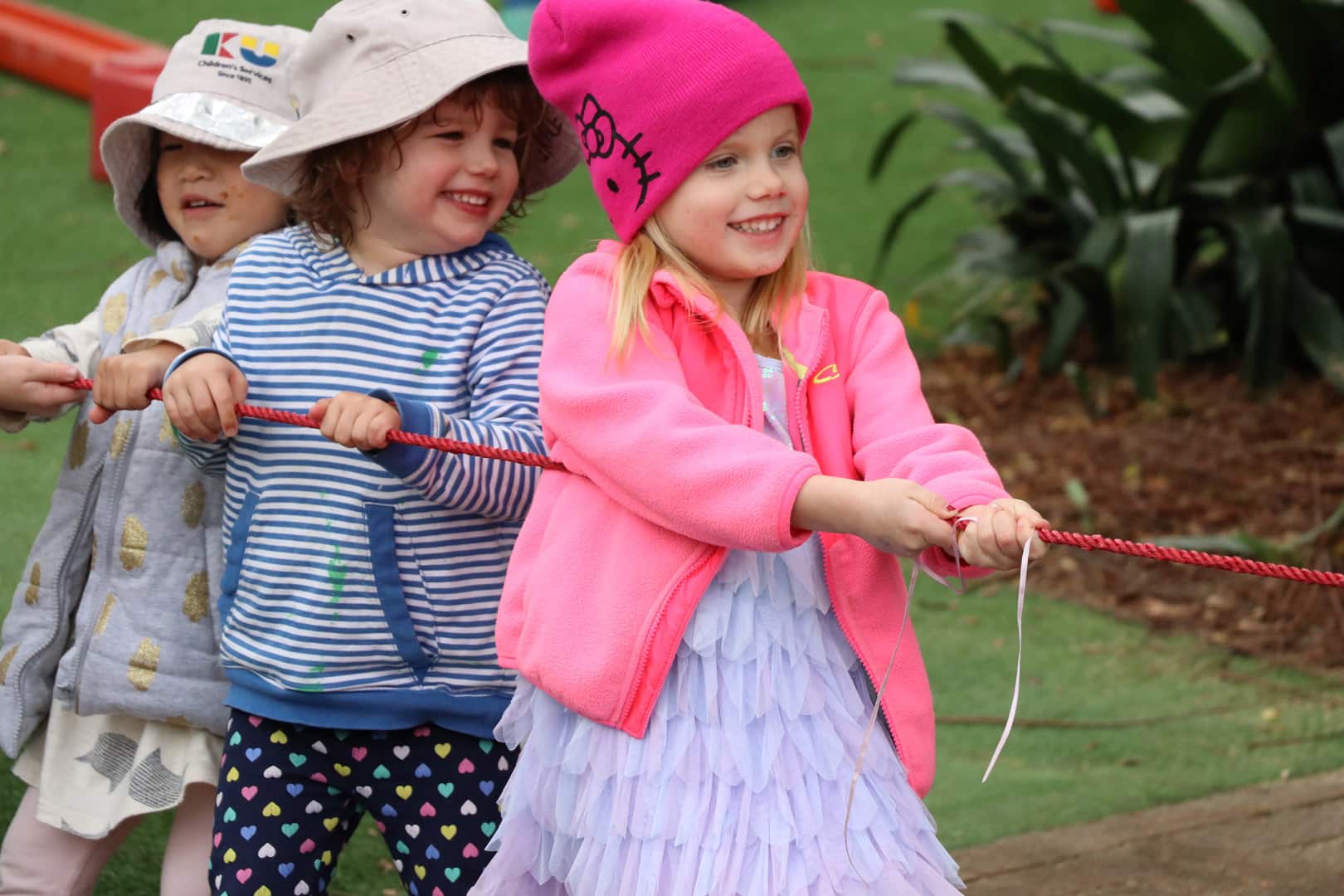 Children playing tug of war at KU Mosman childcare