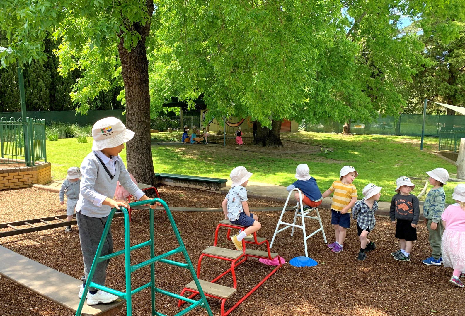 Children playing outdoors at KU Donkin childcare