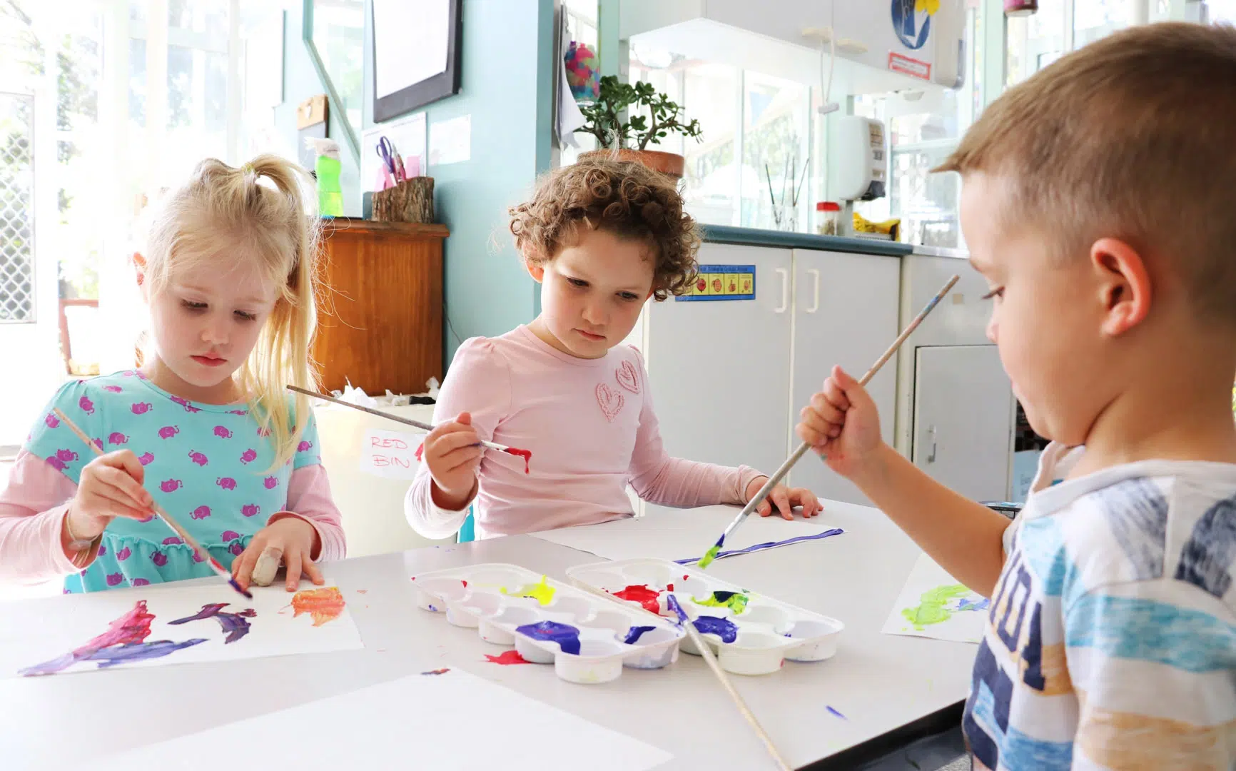 Children doing some painting at KU Kintaiba childcare