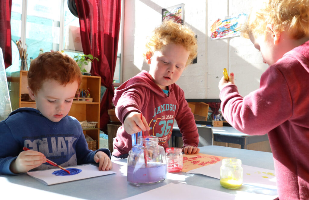 Children doing some painting at KU Kintaiba childcare