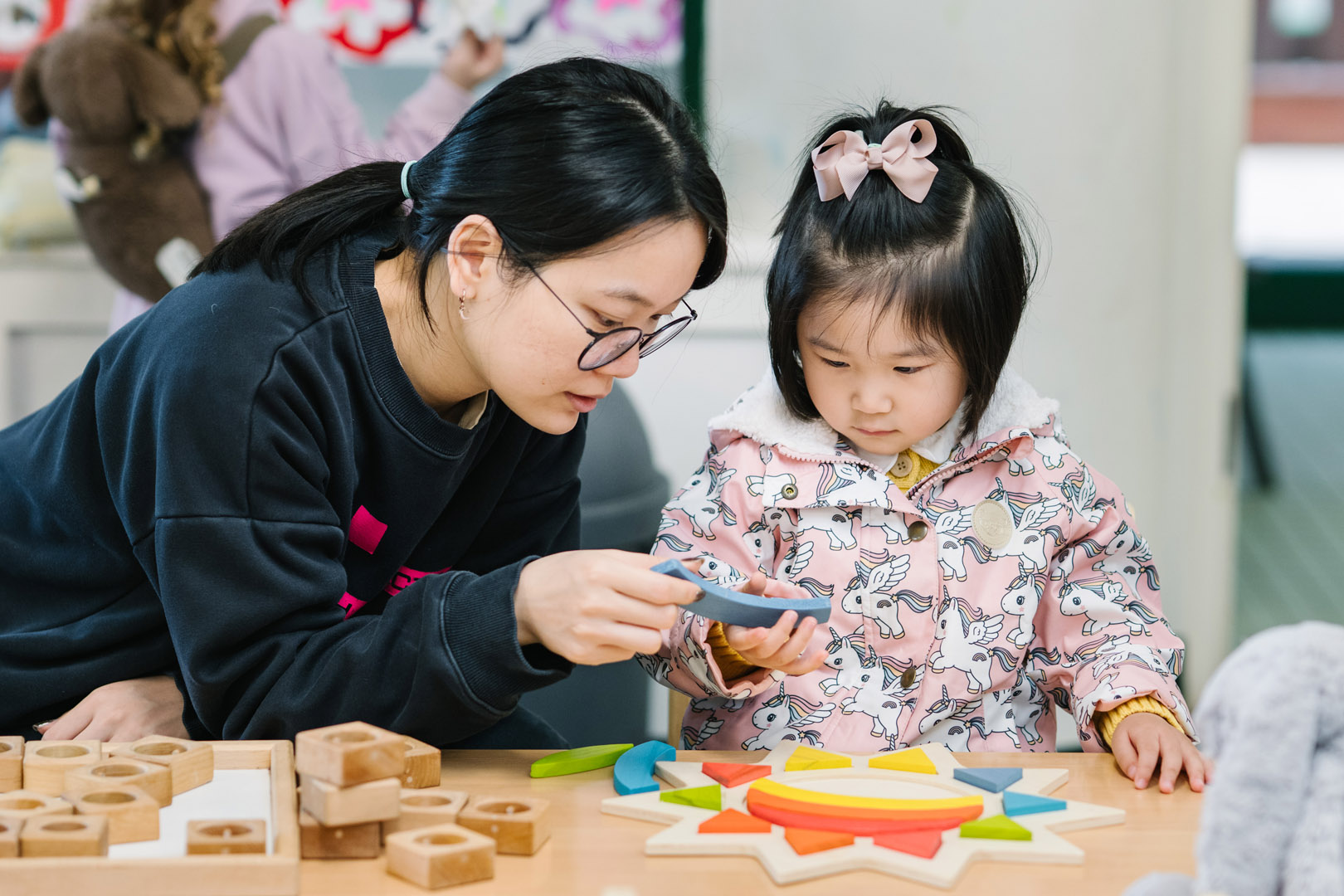 Educator and child engaged in activity at North Sydney Childcare