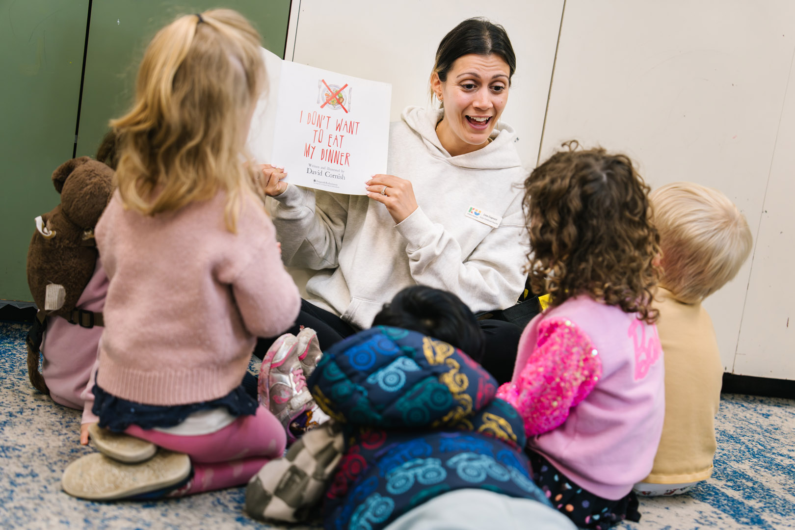 Educator reading to children at North Sydney Childcare