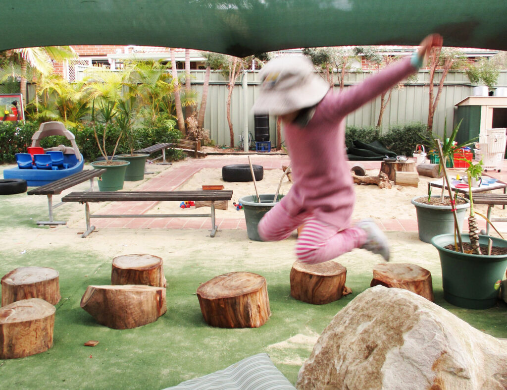 Child playing outdoors at KU Penrith childcare