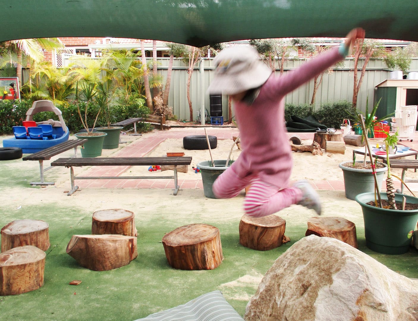 Child playing outdoors at KU Penrith childcare
