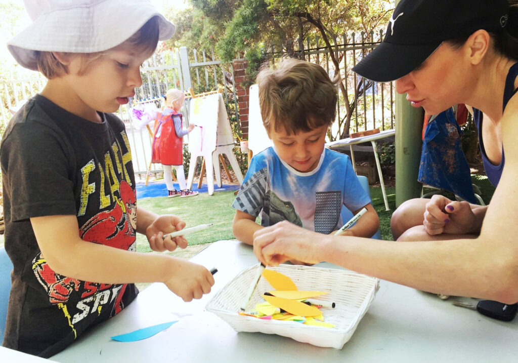 KU Penrith childcare educator and children doing art and crafts