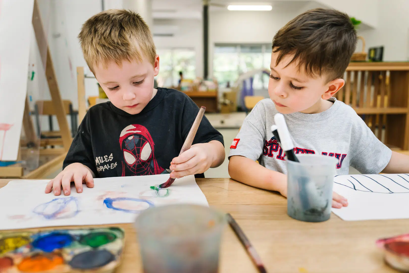 Children painting at KU The Fields childcare in Rowville